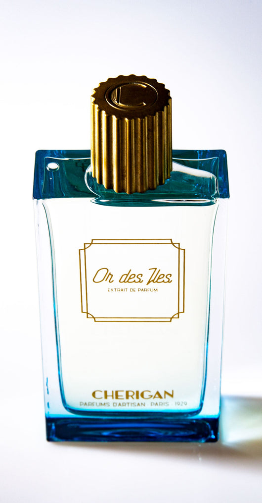 Or des Îles 100ml bottle top visual with the golden cap and the logo